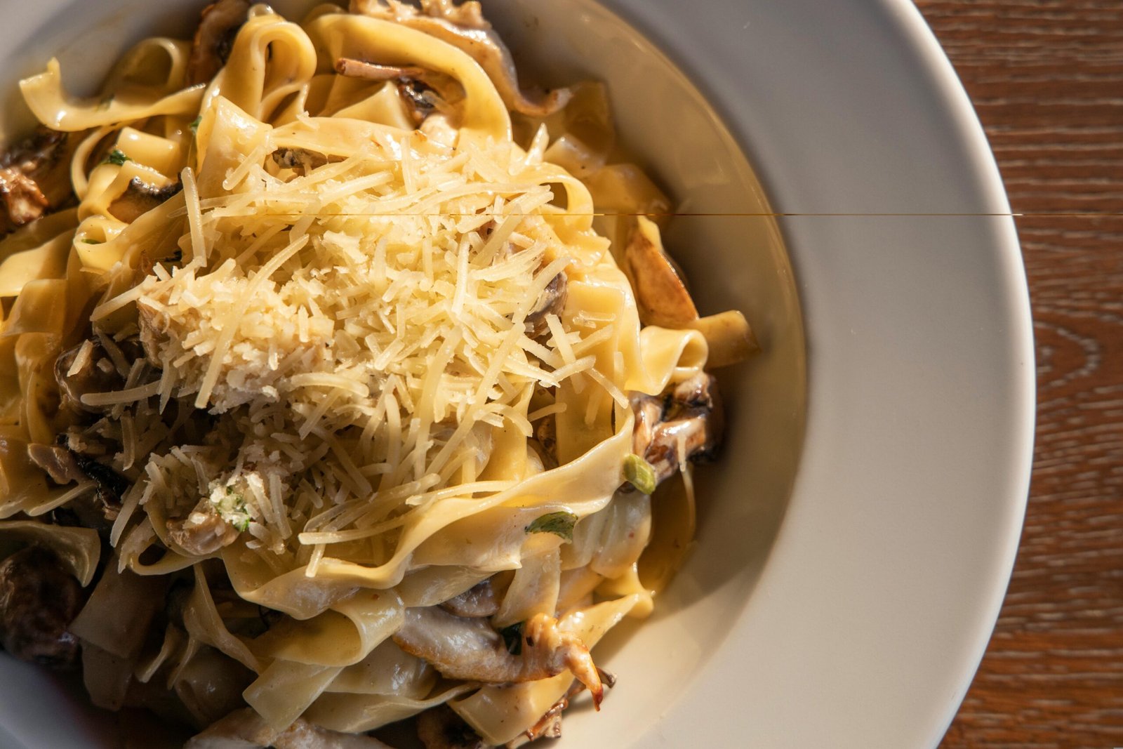 Close-Up View of a Pasta Dish on White Ceramic Bowl